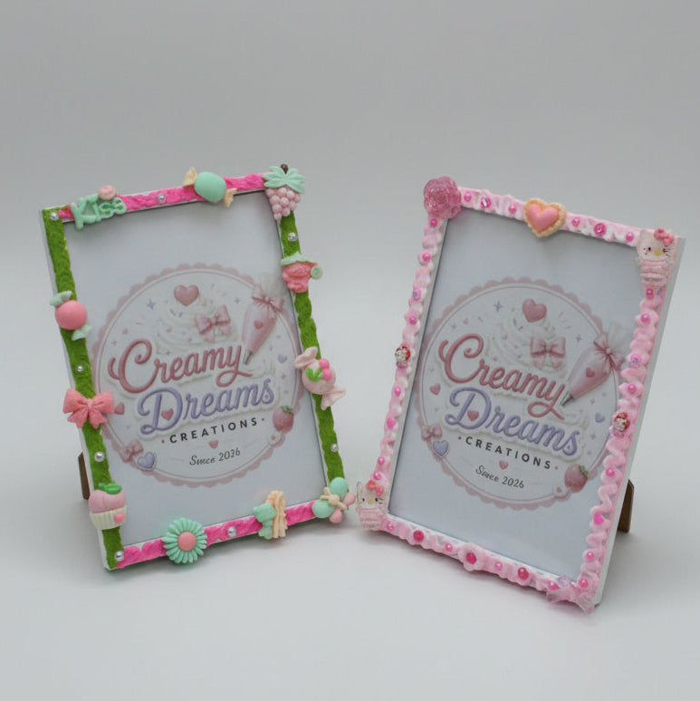 Two decorative picture frames displayed on a pink patterned backdrop. The top frame has a green border with pink, peach, and mint embellishments, and the bottom frame has a pink border with similar decorative details.